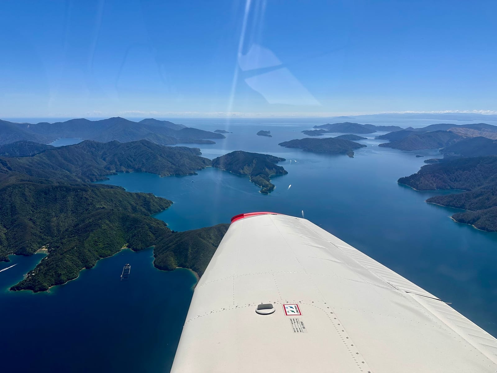 View over the Marlborough Sounds from a light aircraft in flight.